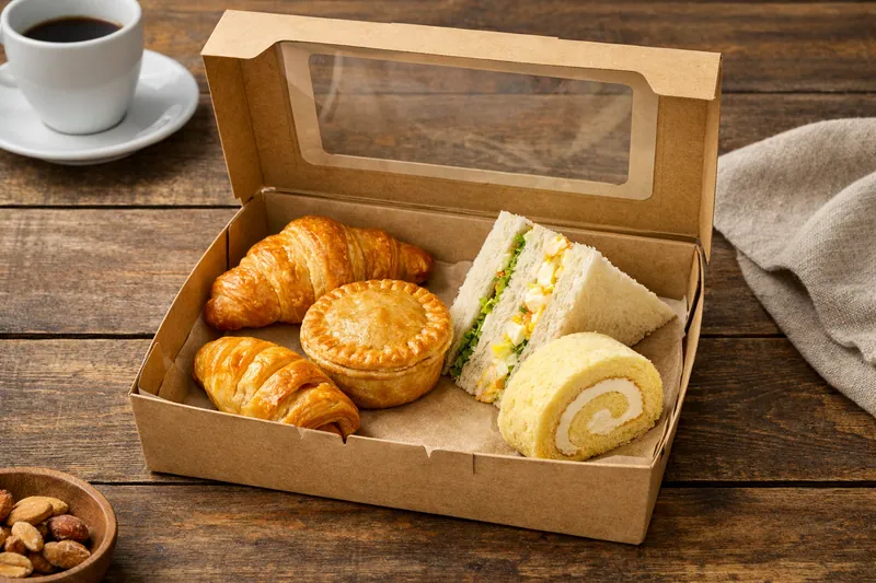 Halal continental breakfast box in Singapore with croissant, chicken pie, apple puff, egg mayo sandwich and Swiss roll for office catering