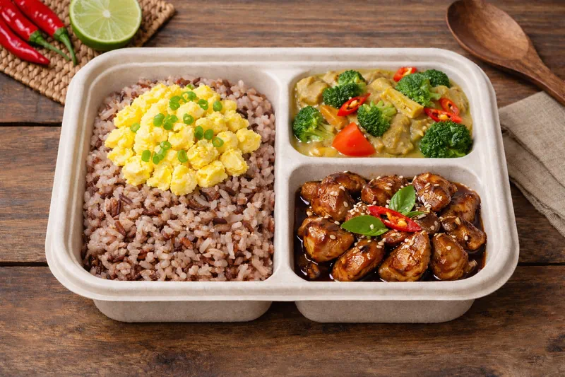 Healthier Choice bento with mixed brown rice, vegan curry vegetable, kicap manis chicken and egg