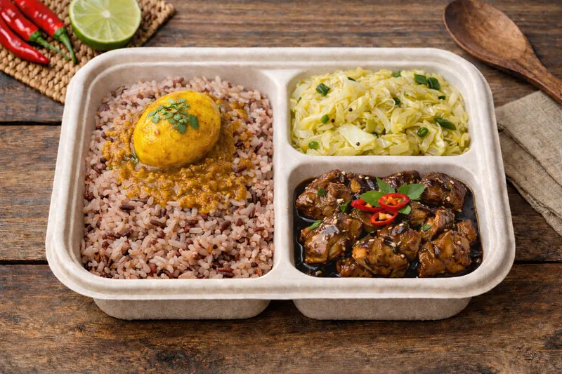 Healthier Choice bento with mixed brown rice, cabbage sabzi, black pepper chicken and egg