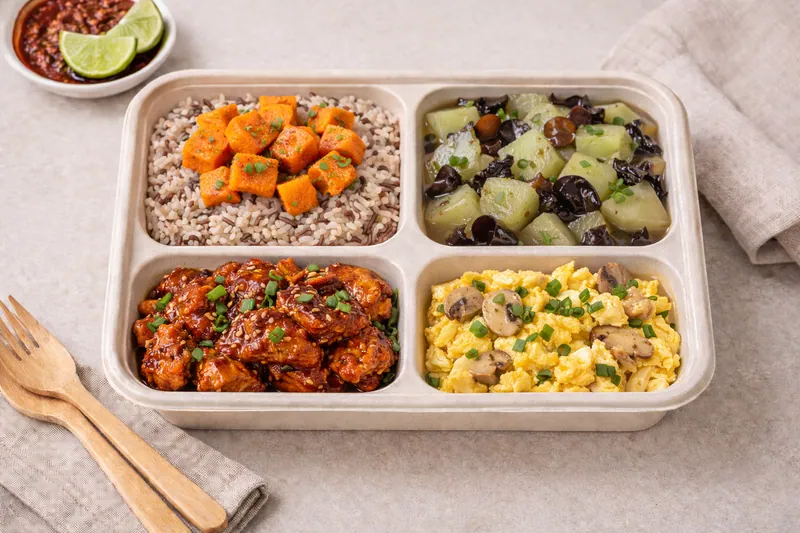 Healthier choice halal bento with brown rice, bulgogi, hairy gourd, egg and sweet potato